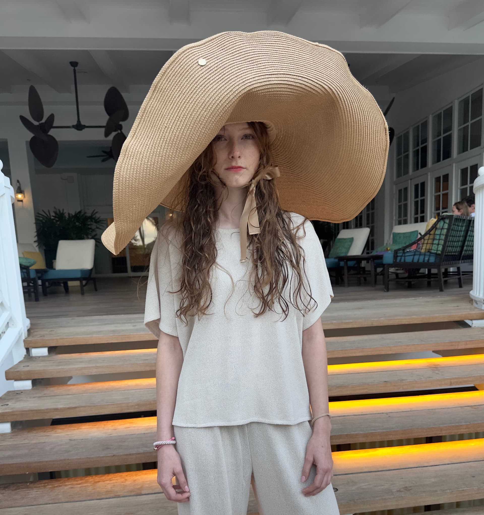 The Anat Fritz Supersized Sunhat worn at a tropical resort