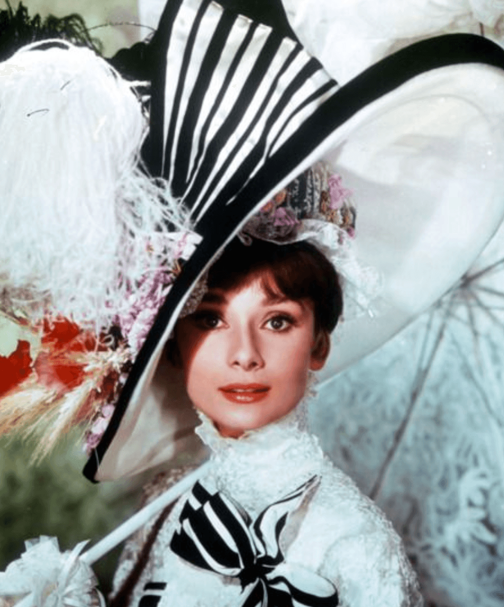 Audrey Hepburn in My Fair Lady wearing an iconic oversized black and white striped hat