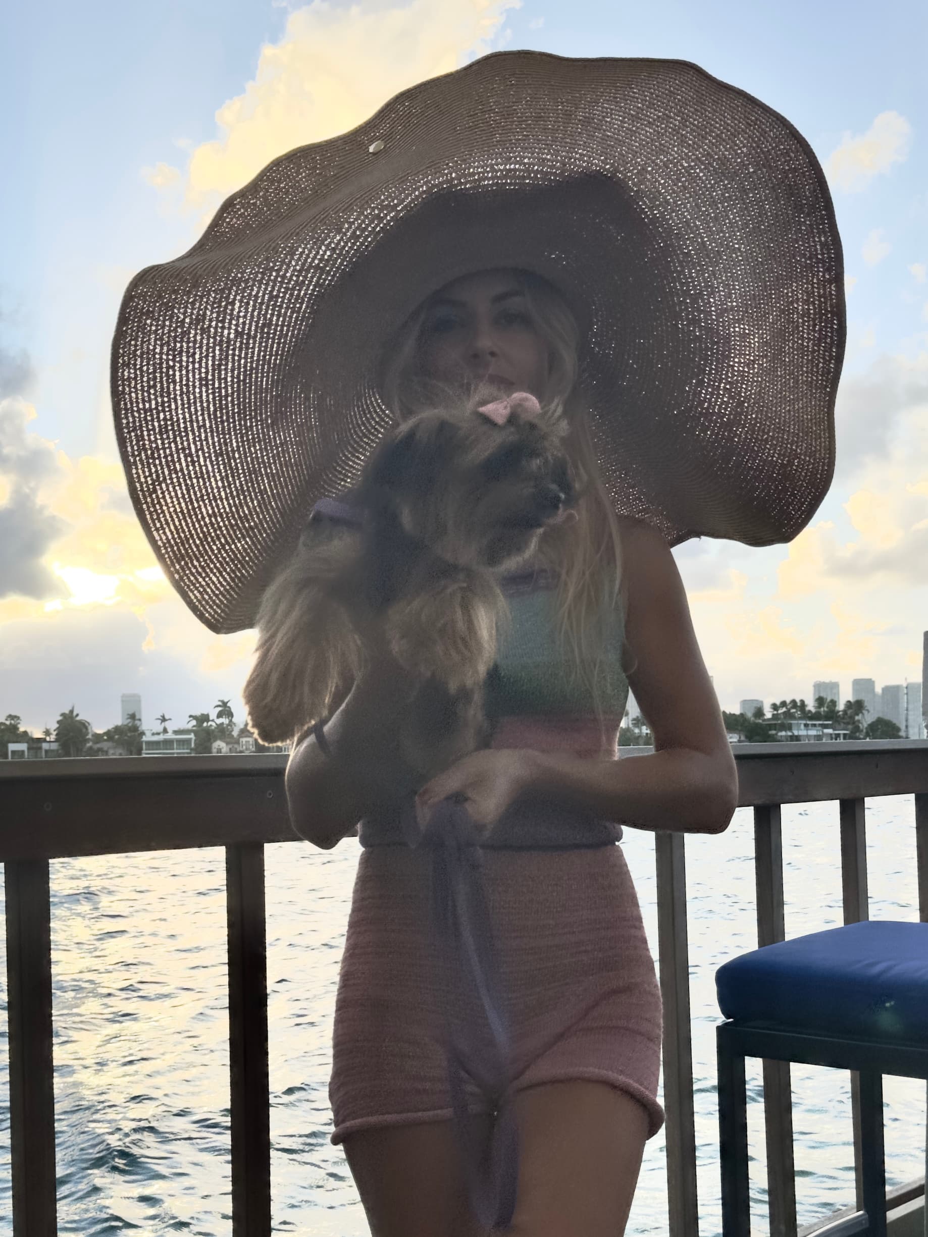 Resort lifestyle - waterfront view with oversized sunhat