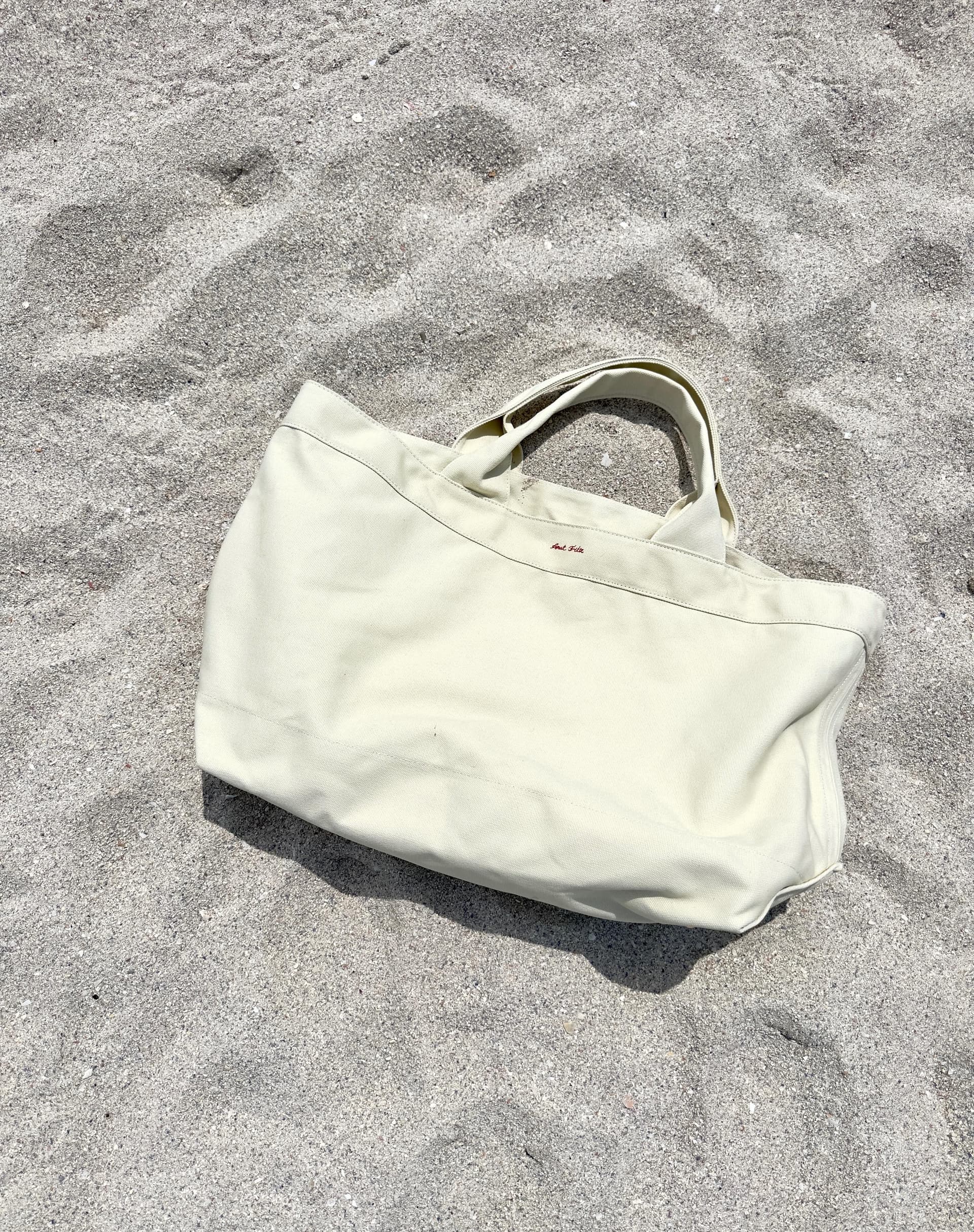Canvas beach tote on sand