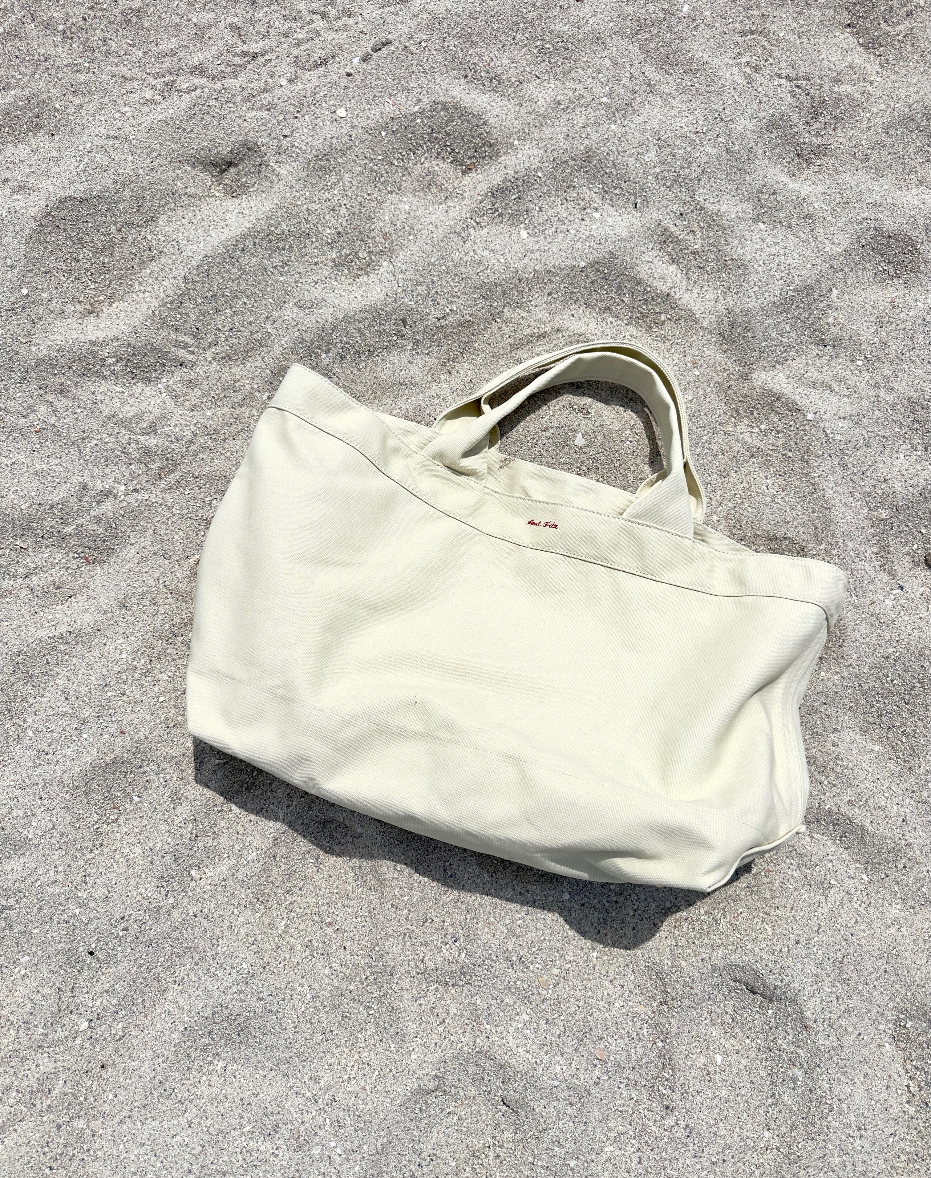 Canvas beach tote on sand